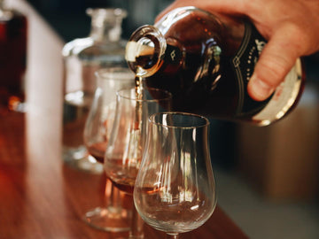 Pouring whisky into a tasting glass